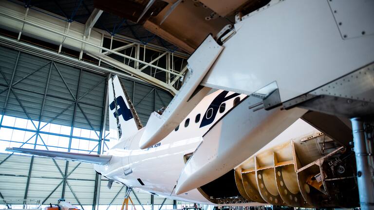 Finnair plane in hangar tale